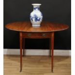 A George III mahogany Pembroke table, moulded oval top with fall leaves above a single frieze