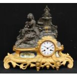 A 19th century French porcelain mounted gilt and patinated metal mantel clock, 8.5cm enamel dial