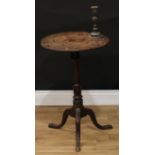 A mid-18th century oak tripod occasional table, near-circular top with incised wavy border, turned