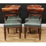 A set of four Regency dining chairs, curved cresting rails, lozenge shaped mid rails, stuffed over