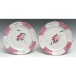 A pair of French faïence lobed octofoil plates, painted in the famille rose palette in underglaze