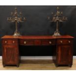 A Regency mahogany bow-centre sideboard, crossbanded top above a central frieze drawer, each