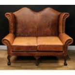 A George II inspired wingback sofa or double wing chair, studded stuffed-over upholstery, squab