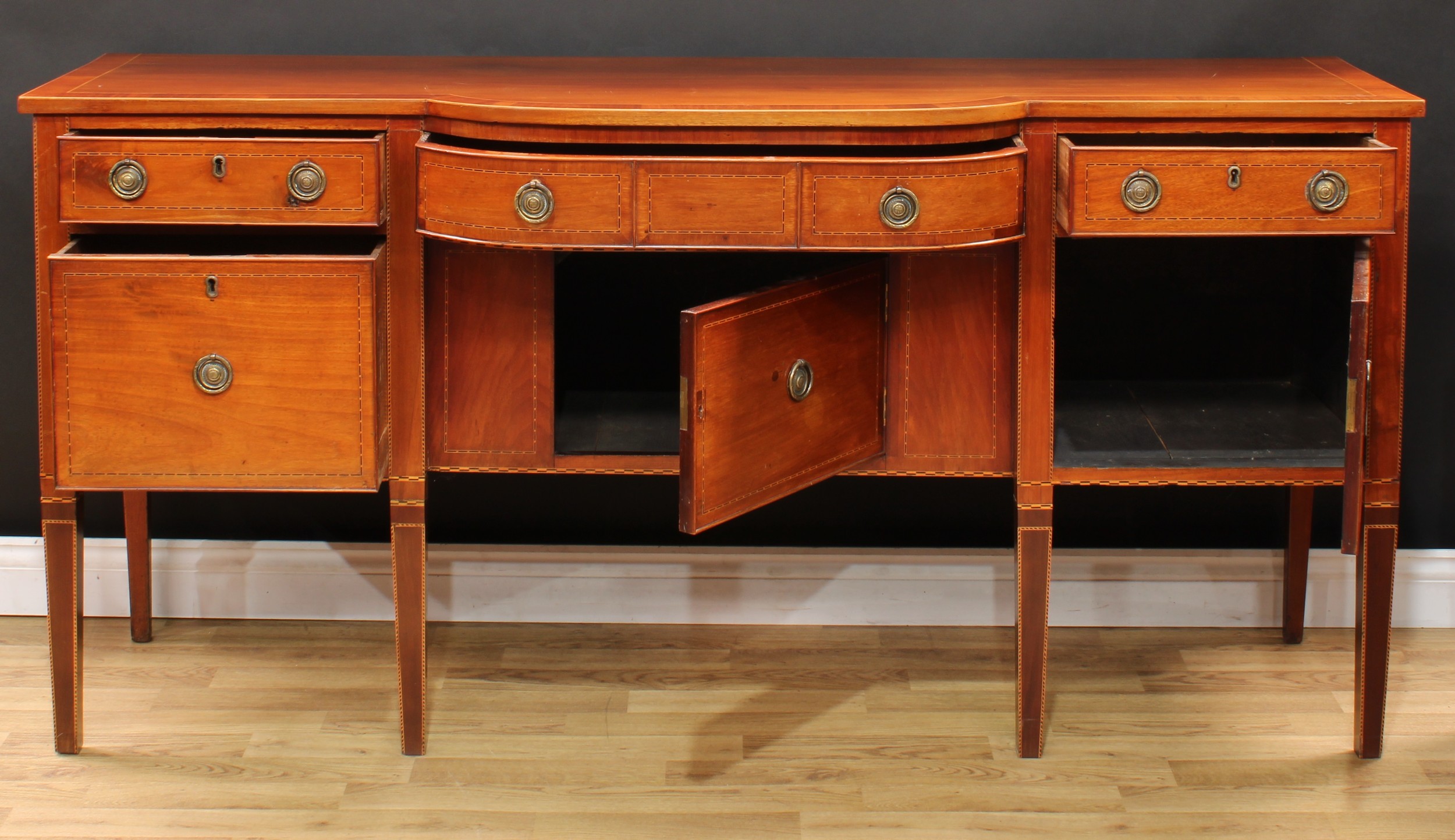 A 19th century mahogany bow-centre sideboard, crossbanded oversailing top above an arrangement of - Image 3 of 5