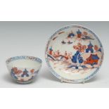 A Lowestoft Dolls House pattern tea bowl and saucer, painted in underglaze blue, iron red and