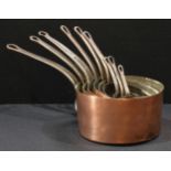 A composed set of nine 19th century graduated copper and steel pans, the smallest body 4cm high, 9cm