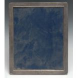A large Elizabeth II silver rounded rectangular easel photograph frame, quite plain, 29cm high,