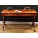 A Regency mahogany and brass marquetry rectangular library table, oversailing top above three frieze