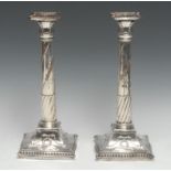 A pair of George III Old Sheffield Plate table candlesticks, of Adam design, incurved canted