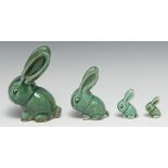 A set of four graduated Bourne Denby Danesby Ware Epic Green gloss glazed Marmaduke rabbits, size 2,