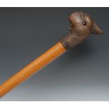 A 19th century novelty automaton walking stick, the substantial Black Forest type handle carved as