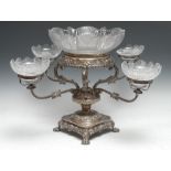 A post-Regency Old Sheffield Plate table-centre epergne, pedestal base with leafy boss under-finial,
