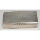 A large Victorian silver rectangular table snuff box, hinged cover with foliate thumbpiece, engine