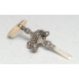 A George V silver, mother-of-pearl and bone baby's rattle, typically chased, 13cm long, Crisford &