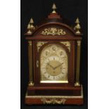 A substantial Edwardian gilt metal mounted mahogany bracket clock, 20.5cm arched brass dial with