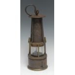 Coal Mining - a 19th century steel and brass miner's lamp, oversailing circular cresting above a