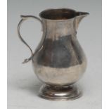An early George III silver sparrow beak cream jug, scroll-capped handle, domed foot, 8.5cm high,