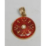 A Faberge limited edition circular red enamel and diamond inset 18ct gold circular locket, round