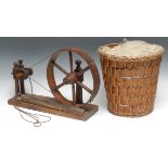 A 19th century elm table top spinning wheel, rectangular base, 44cm wide; a basket of raw wool (2)