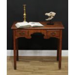 A George III oak lowboy, rectangular top with moulded edge above an idiosyncratic frieze with two