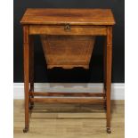 An Edwardian rosewood work table, hinged rectangular top enclosing a compartmented interior, the