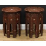 A near pair of Moorish hardwood and marquetry octagonal occasional tables, dished tops, carved