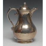 A Victorian silver baluster hot water jug, hinged domed cover with bud finial, scroll handle, 22cm