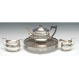 A George VI silver four piece boat shaped tea service, comprising teapot, milk jug and sugar