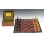 An early 20th century boxwood and ebony Staunton pattern weighted chess set, The Staunton