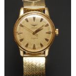 Longines - a Conquest automatic gold cased wristwatch, textured dial, centre seconds, shaped block