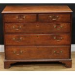 A George III oak chest, rectangular top with moulded edge above two short and three long graduated