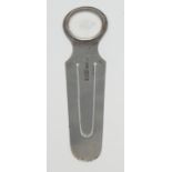 A late Victorian/Edwardian silver novelty bookmark, the terminal with a magnifying glass, 9cm