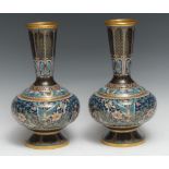 A pair of Chinese cloisonne enamel vases, brightly decorated in polychrome with butterflies,