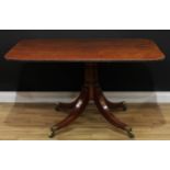 A Regency mahogany breakfast table, rounded rectangular tilting top with reeded edge, ring-turned