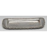 An Old Sheffield Plate shaped rounded rectangular chased and engraved with flowers and scrolling