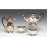 A George V silver four piece tea and coffee set, of panelled form, comprising coffee pot, teapot,