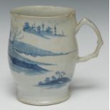 A Longton Hall ale mug, painted in underglaze blue with stylised trees and landscape, crabstock