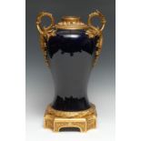 A French porcelain two handled gilt metal mounted vase, in cobalt blue, with acanthus leaf scroll