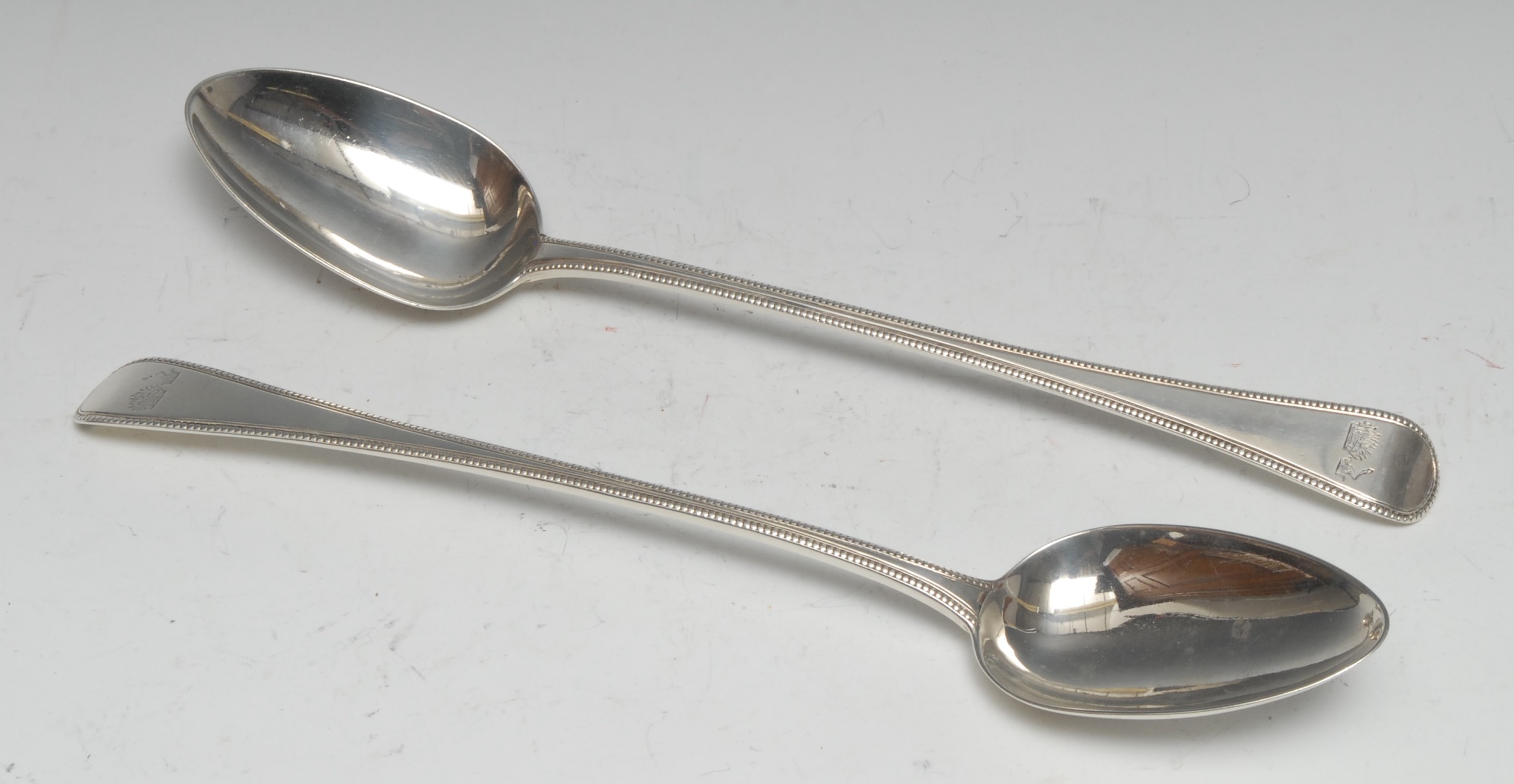 A pair of George III Old English bead pattern basting spoons, 30.5cm long, William Eley, William