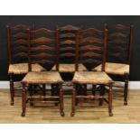 A set of five 19th century Lancashire ladder back 'regional' chairs, each with rush seats, turned