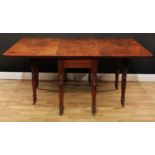 A 19th century mahogany gateleg dining table, rectangular top with fall leaves, ring-turned legs,