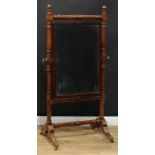 A Regency mahogany cheval mirror, bevelled rectangular plate, turned supports and stretcher, sabre