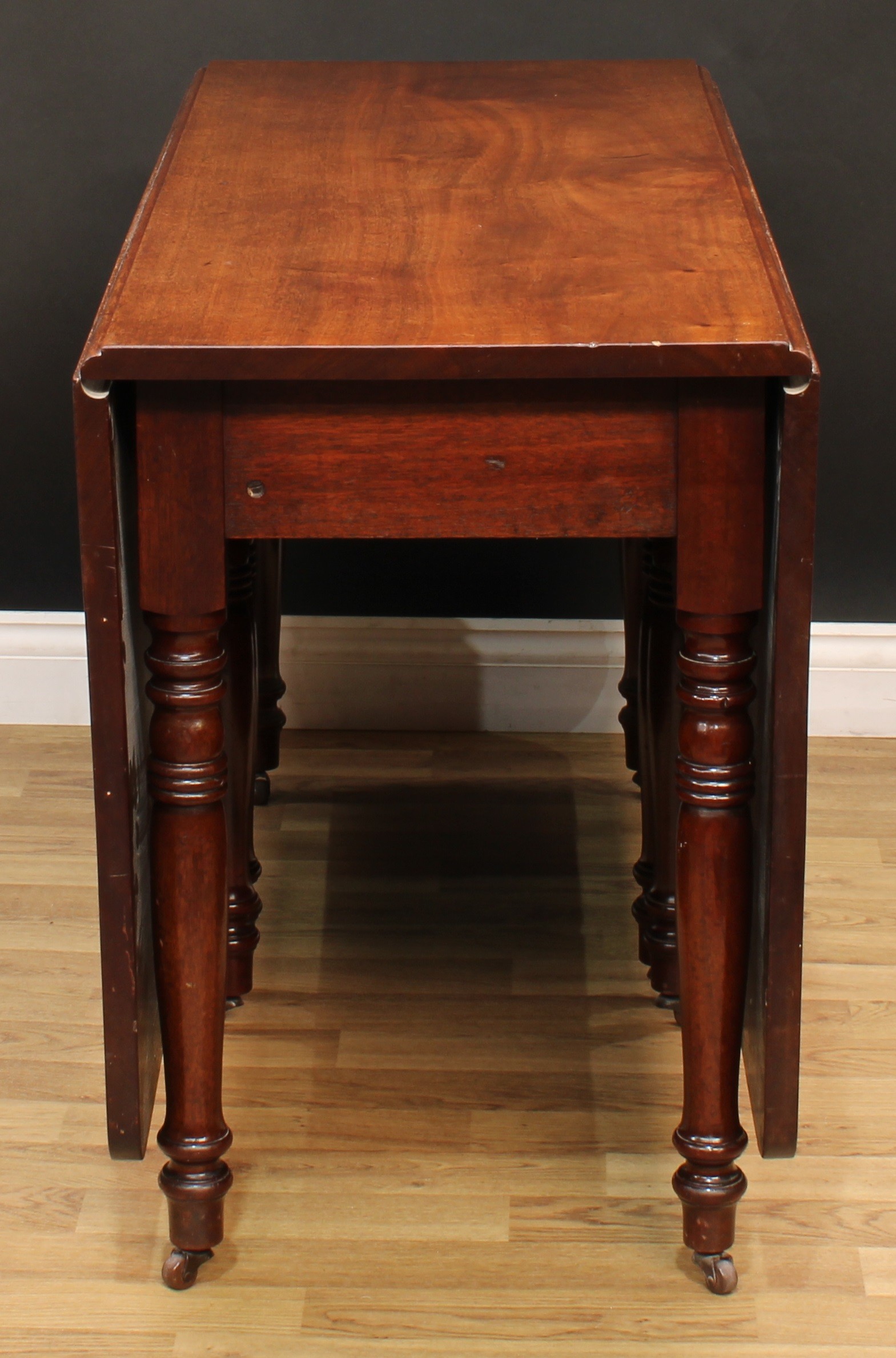 A 19th century mahogany gateleg dining table, rectangular top with fall leaves, ring-turned legs, - Image 2 of 4