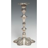A George II cast silver table candlestick, of seamed construction, detachable nozzle, knopped