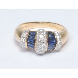 A sapphire and diamond dress ring, arched crest inset with three sections of round brilliant cut