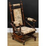 A late 19th century child's American spring rocking chair, traditionally ring-turned throughout,
