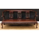 A Chinese hardwood triple yoke back horseshoe sofa, downswept arms terminating in outswept scroll