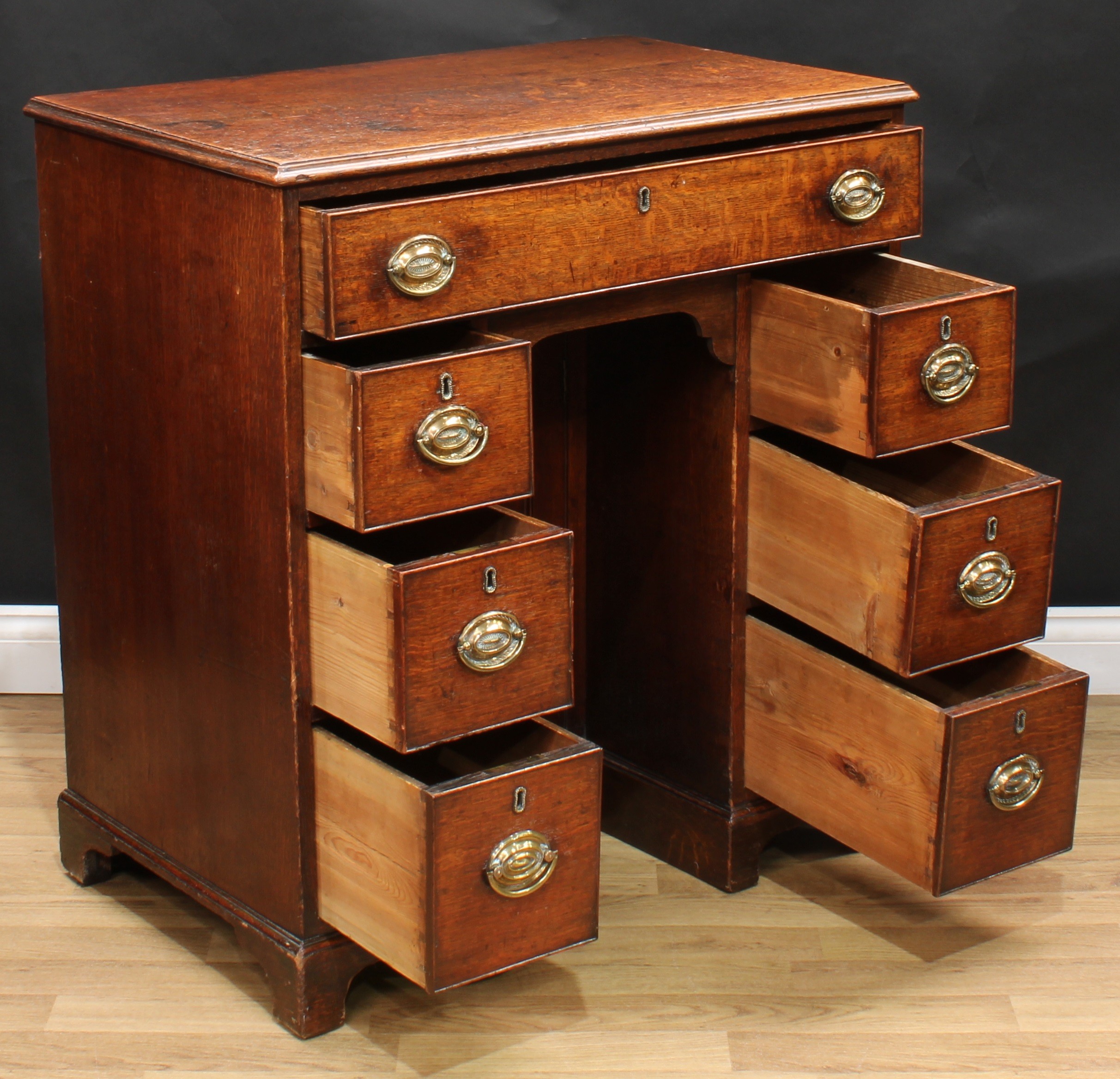 A George III oak kneehole desk, rectangular top with moulded edge above a long cockbeaded frieze - Image 4 of 6