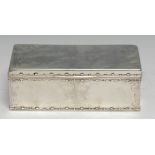 Tiffany & Co - a large American silver rounded rectangular cigar box, hinged cover in relief with