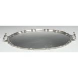 A George V silver two handled shaped oval serving tray, 66cm wide, Barker Brothers, Birmingham 1925,
